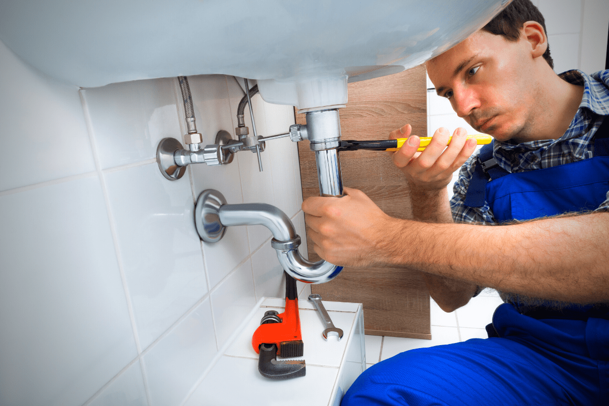 lawrenceville-plumber-repairing-drain